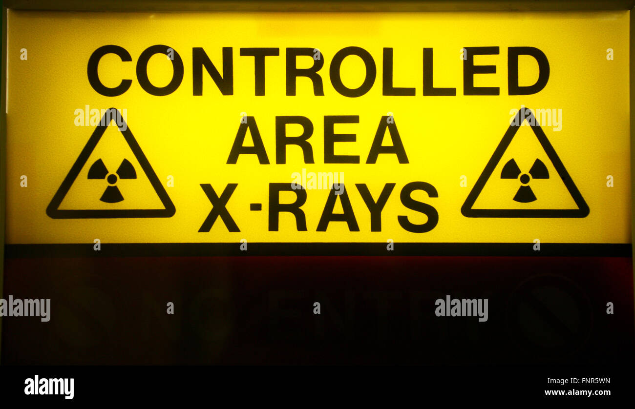 Yellow warning sign for x-ray room. Stock Photo