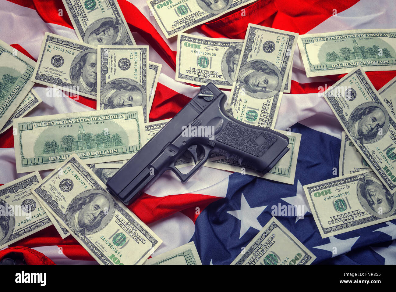 gun, dollar and american flag Stock Photo