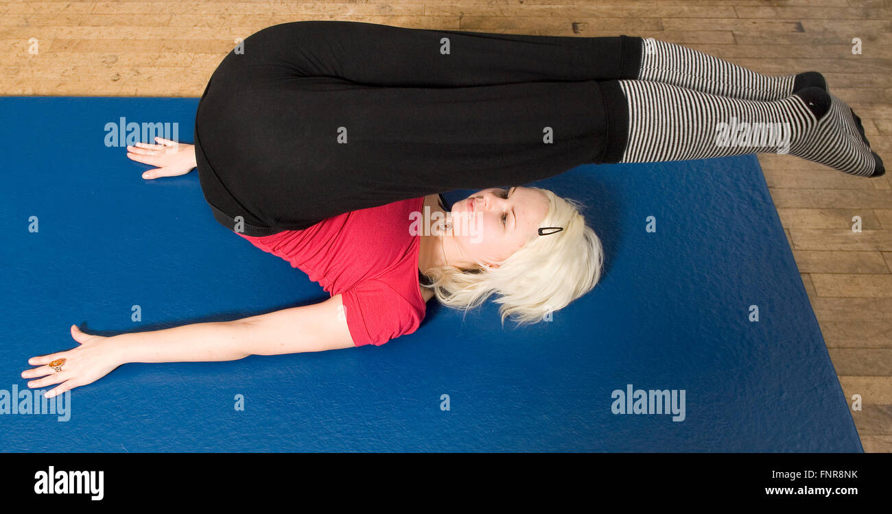 Woman doing lying low back twist stretch exercise Vector Image