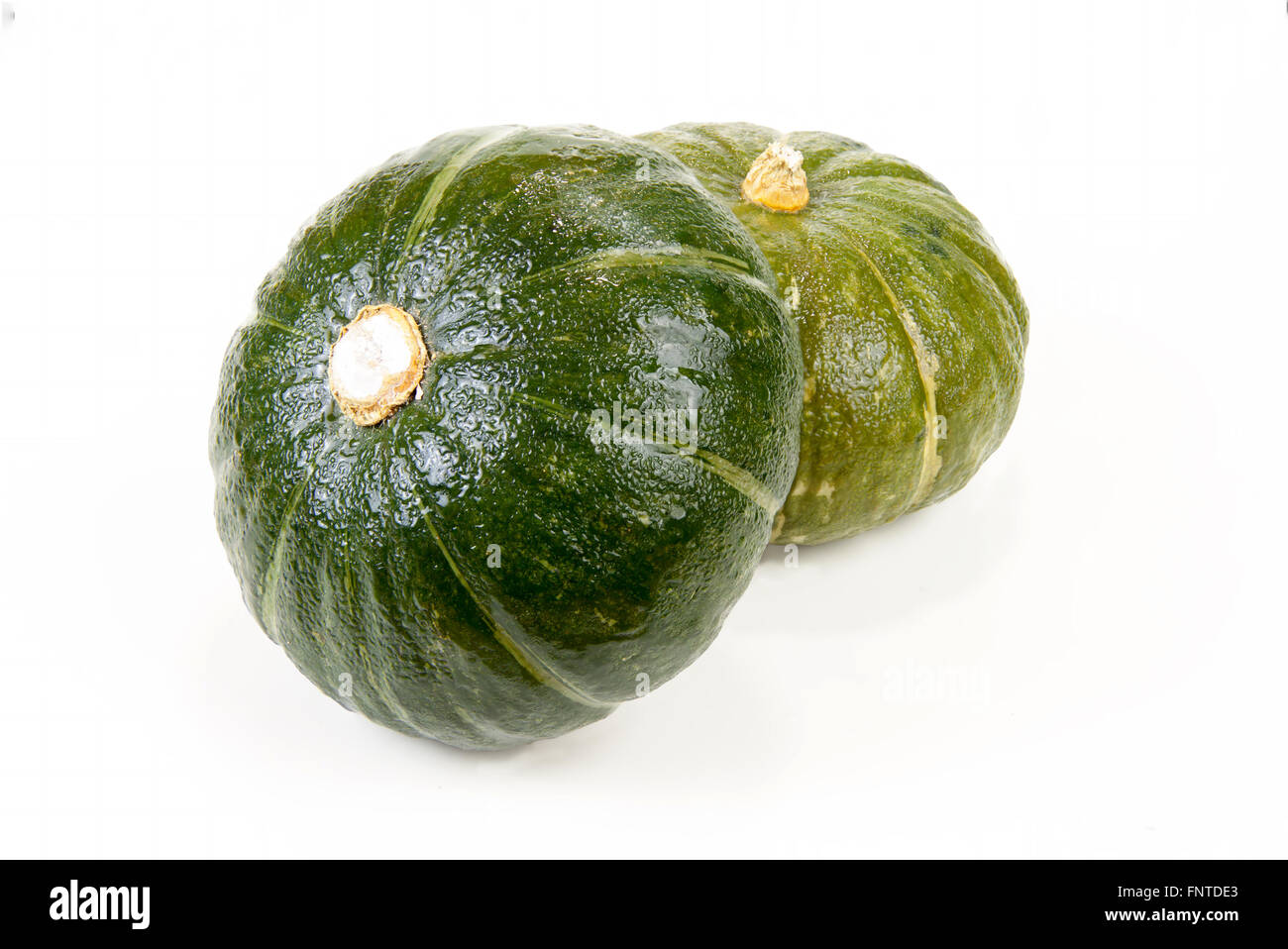 Fresh Green Japanese Pumpkin on isolated white background with clipping paths Stock Photo