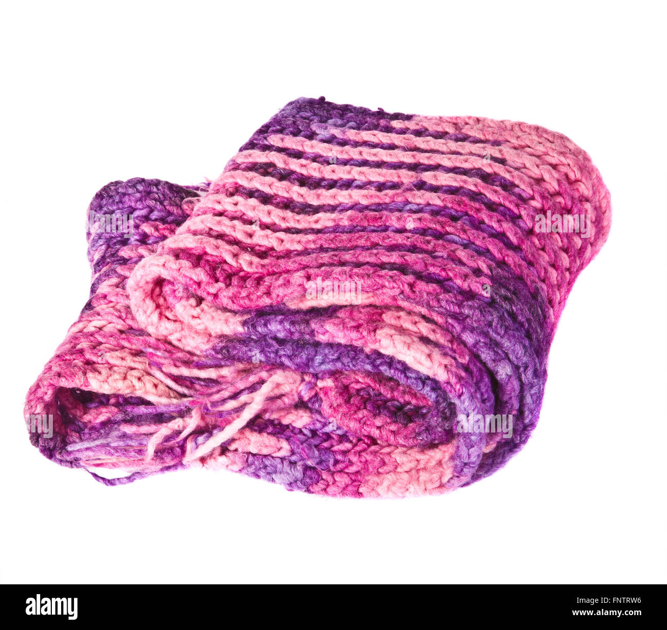 piled knitted scarf on a white background Stock Photo