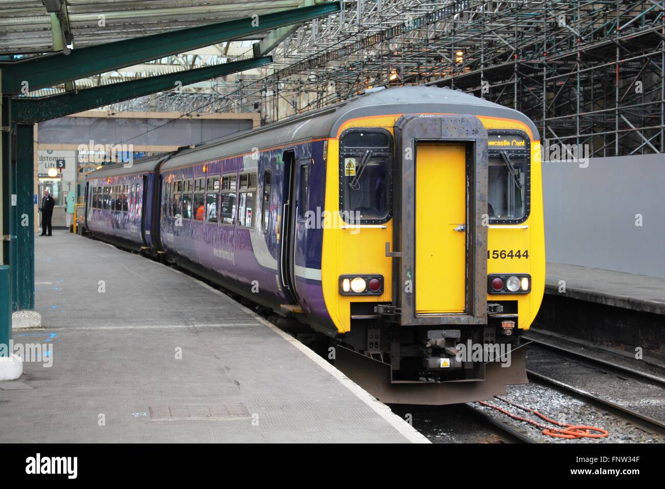 Class 156 diesel multiple unit in Northern rail livery waiting to set off on a passenger service to Newcastle Central. Stock Photo