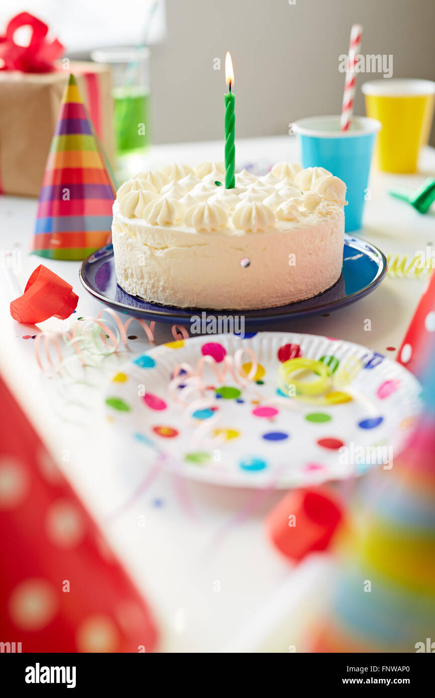 Birthday cake with one candle on the table Stock Photo Alamy