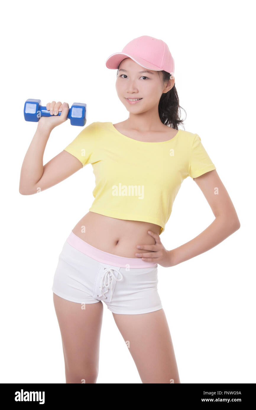 Beautiful Asian woman working out using dumbbell weights isolated on a white background Stock Photo