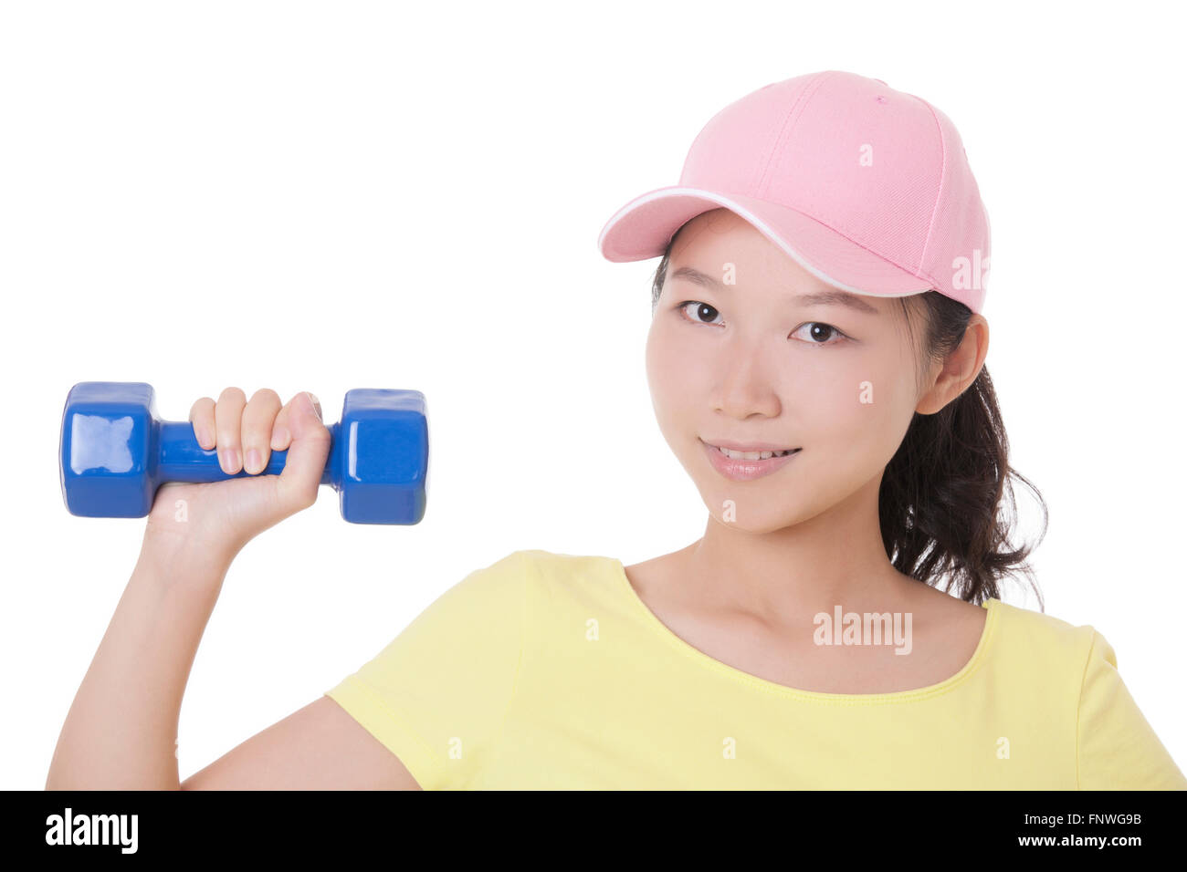 Beautiful Asian woman working out using dumbbell weights isolated on a white background Stock Photo
