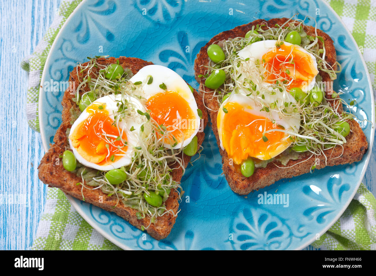 Avocado and egg toast Stock Photo - Alamy