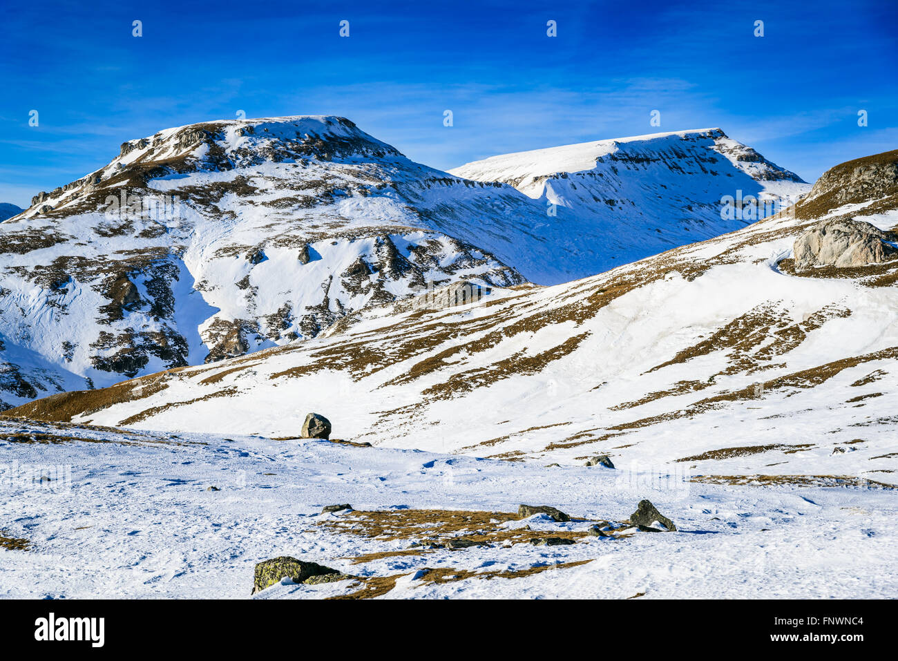 Bucegi Mountains, Romania. Stunning winter scenery in Carpathian Mountains ridge on touristic plateau of Bucegi. Stock Photo
