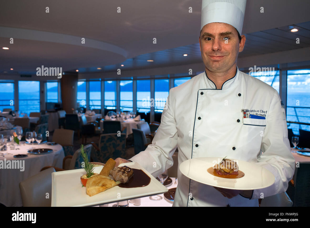 Stefan Berndt, the executive chef of Paul Gauguin show some dishes of the restaurant, 2-star Michelin. Paul Gauguin cruise, Soci Stock Photo