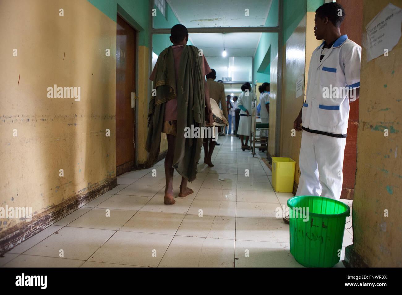 A patient is carried on a stretcher through a hospital corridor, Ethiopia, Africa. Stock Photo
