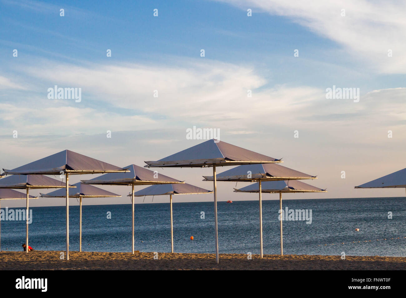 Umbrellas on the beach on the black sea Stock Photo