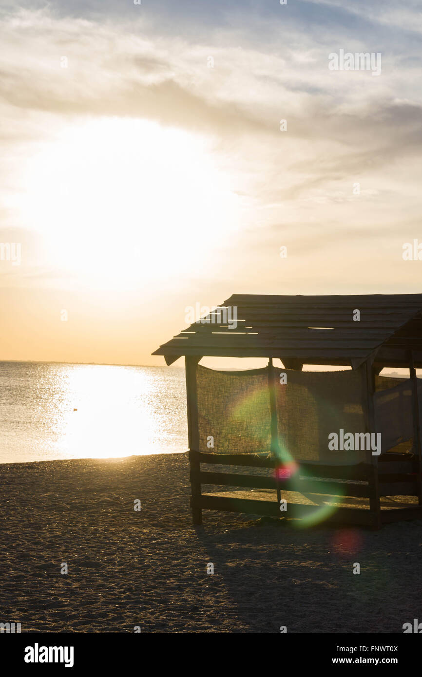 Beach huts for shelter from the sun at sunset Stock Photo - Alamy