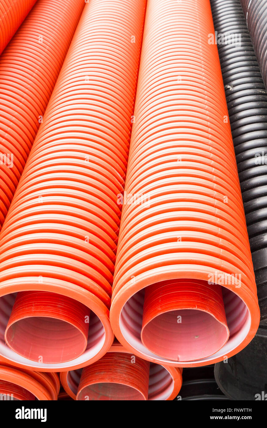 Construction orange and black plastic pipes Stock Photo Alamy