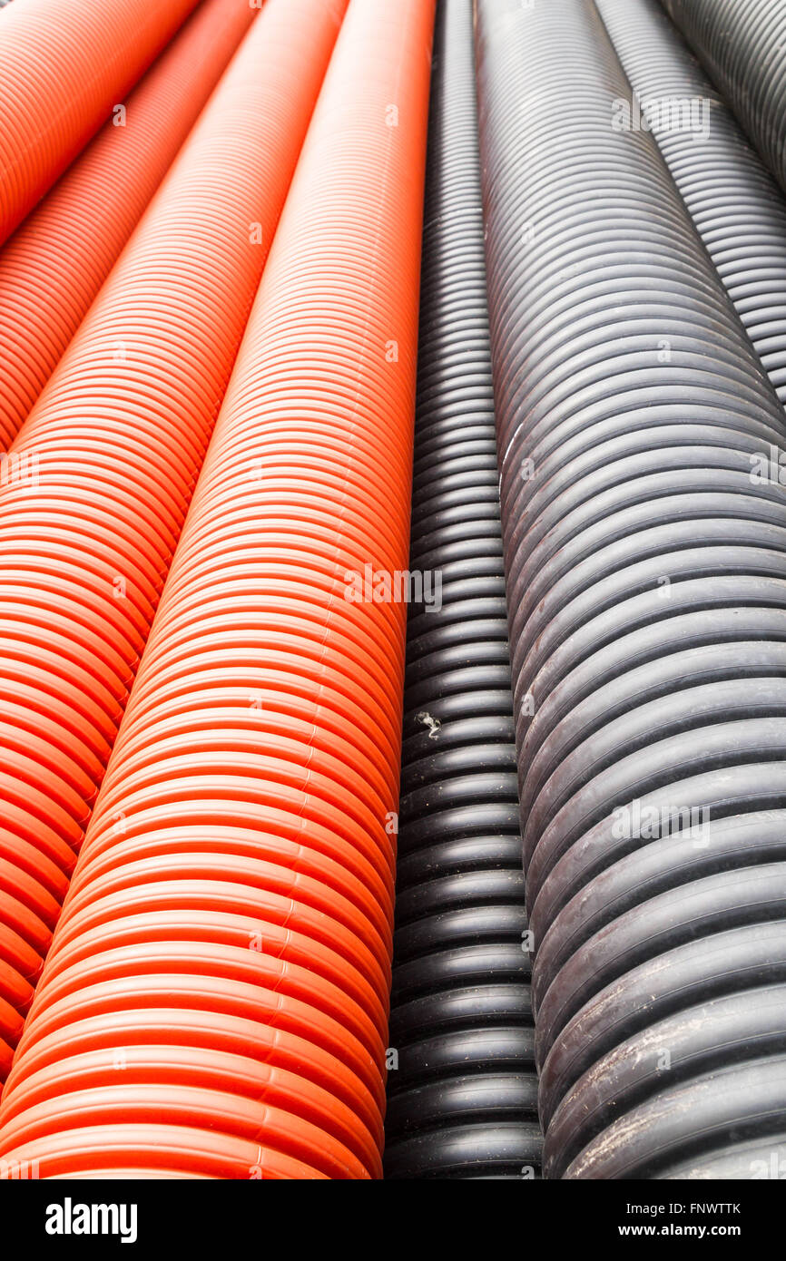 Construction orange and black plastic pipes Stock Photo Alamy