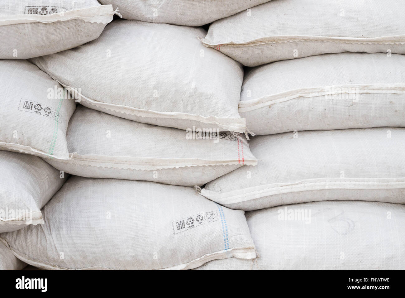 White sand bags on the basis of an open construction Stock Photo - Alamy