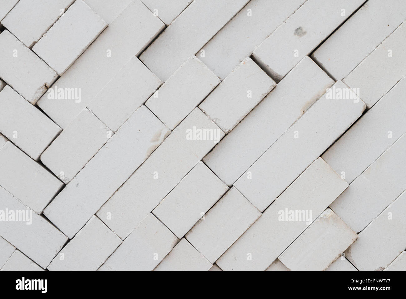 Bricks stacked in a warehouse building base Stock Photo