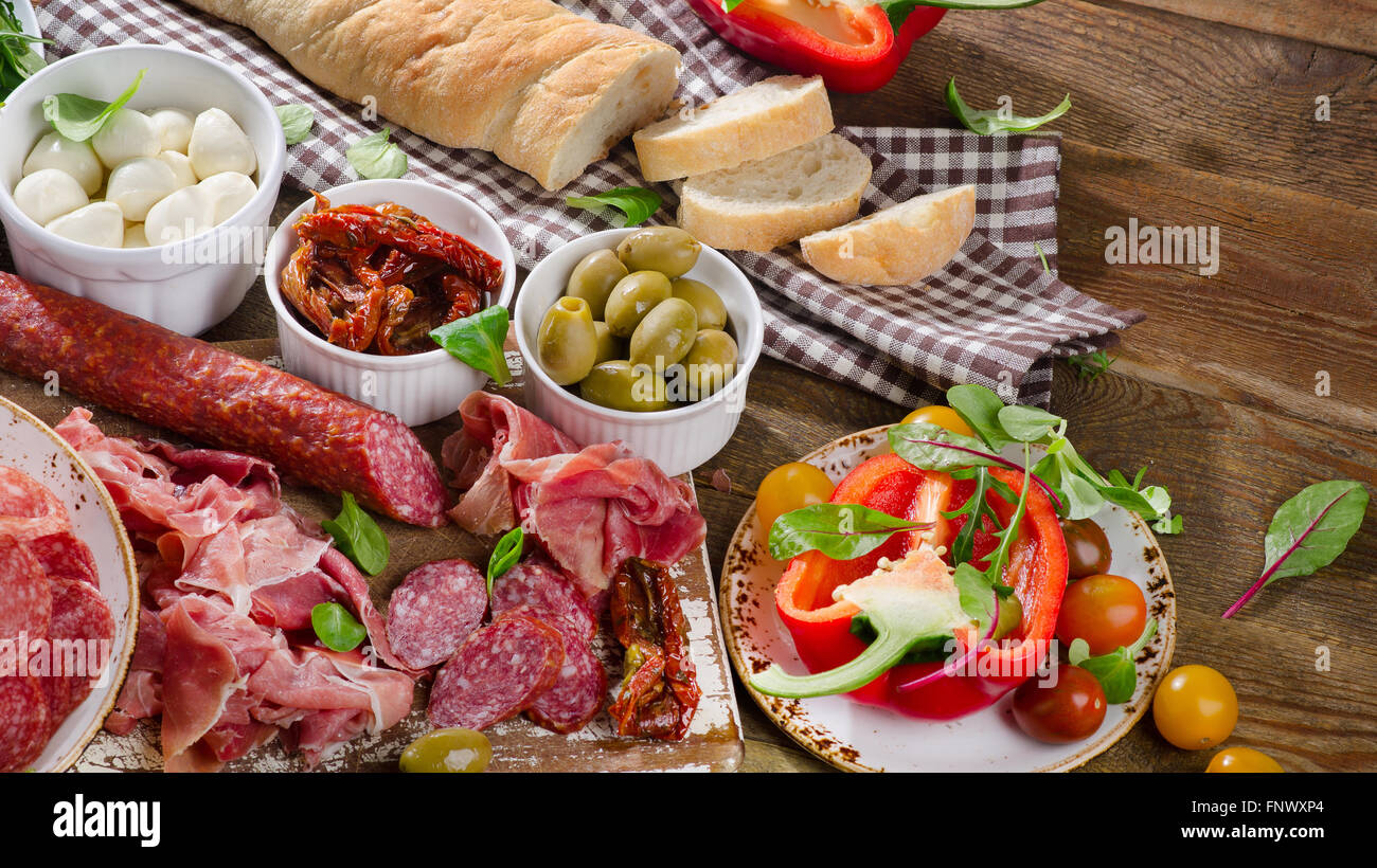 Italian antipasto on wooden table. Healthy eating. Top view Stock Photo