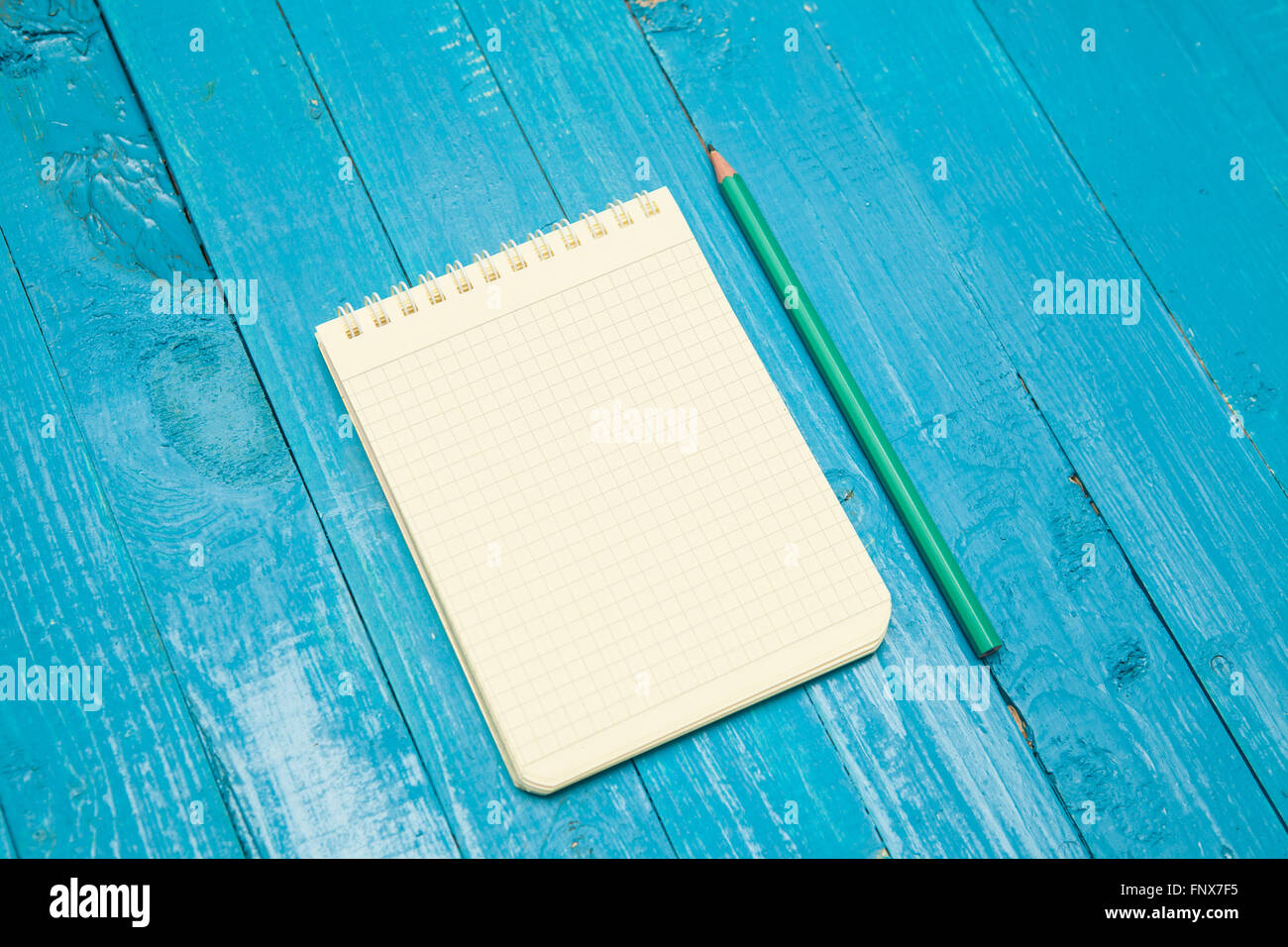 notebook  on a blue wooden background Stock Photo