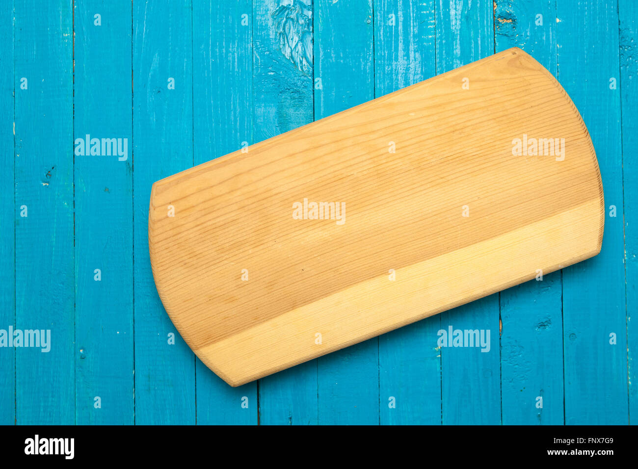 cutting board on a blue wooden background Stock Photo