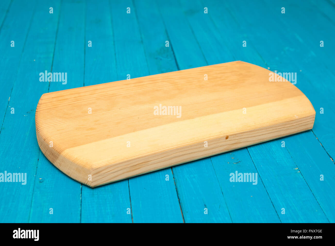 cutting board on a blue wooden background Stock Photo