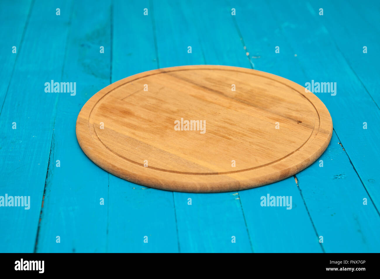 cutting board on a blue wooden background Stock Photo