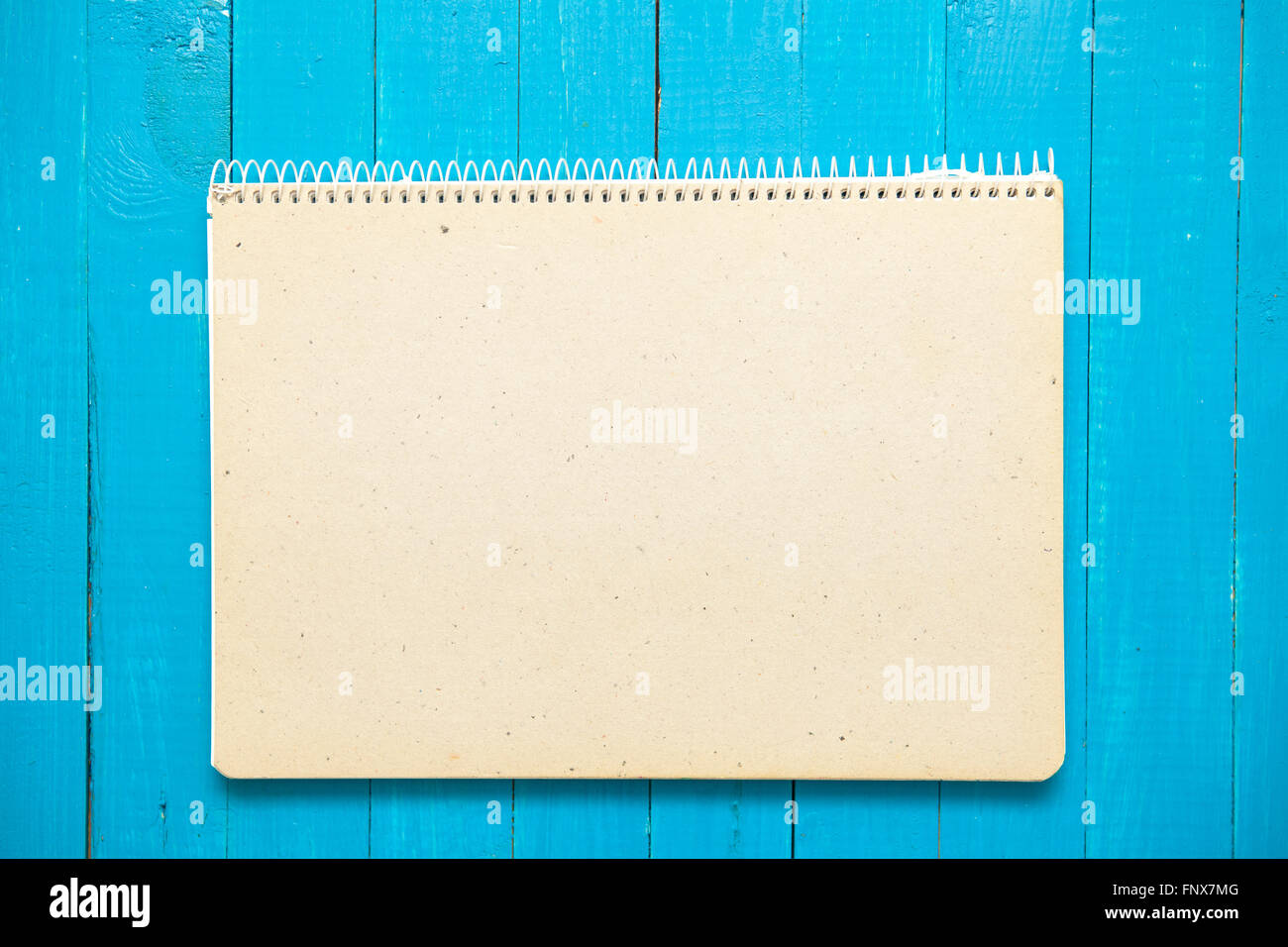 Two open notebook on a blue wooden background Stock Photo - Alamy