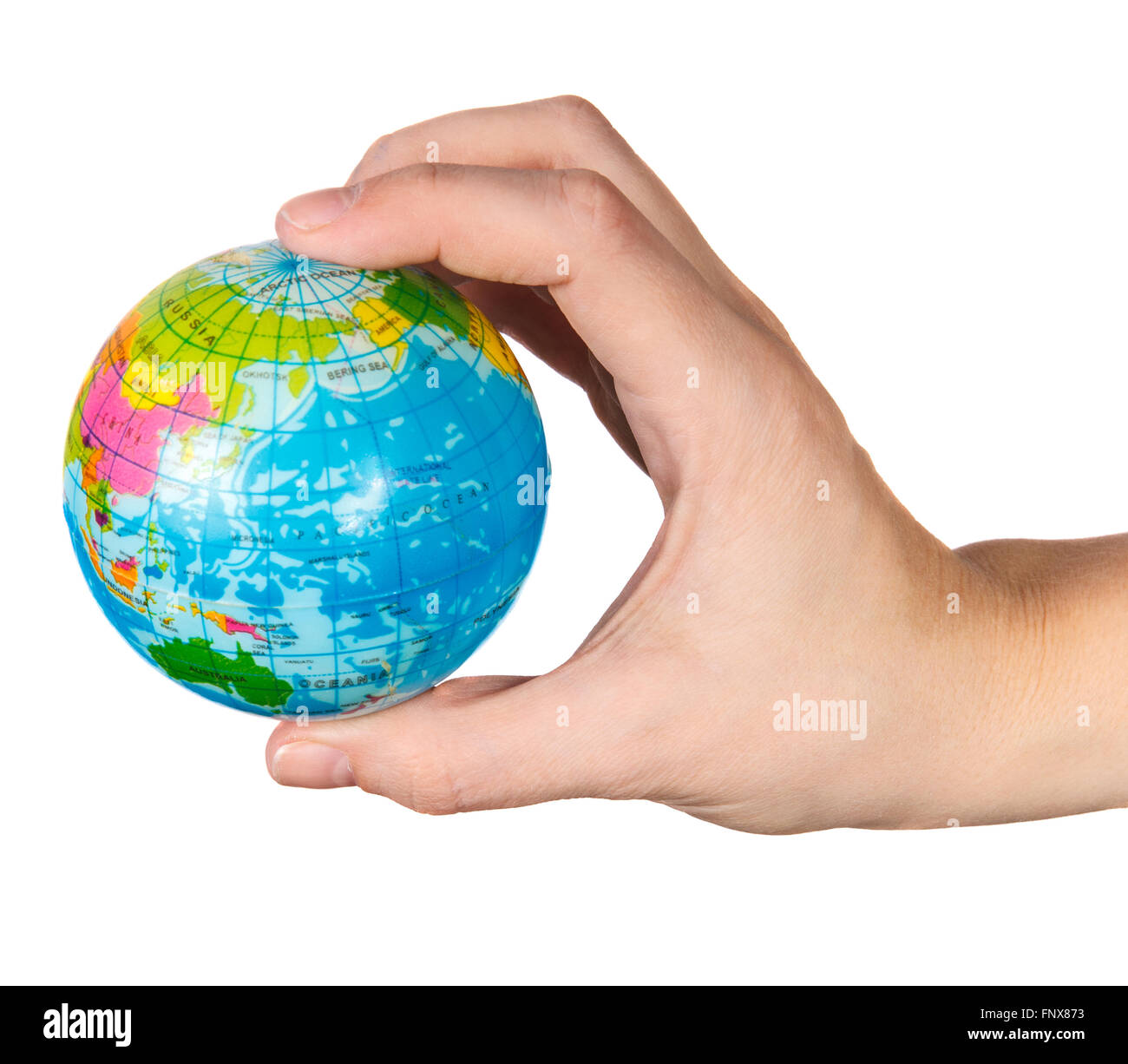 small model of the globe in the hand of the girl on a white back Stock Photo