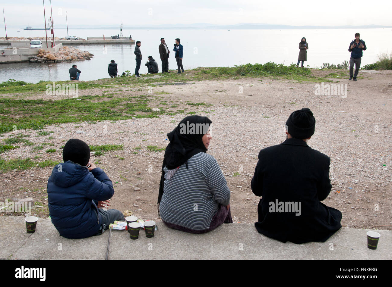 Chios Island, one of the places where refugees from Turkey land en route to Northern Europe. Newly arrived refugees relax Stock Photo