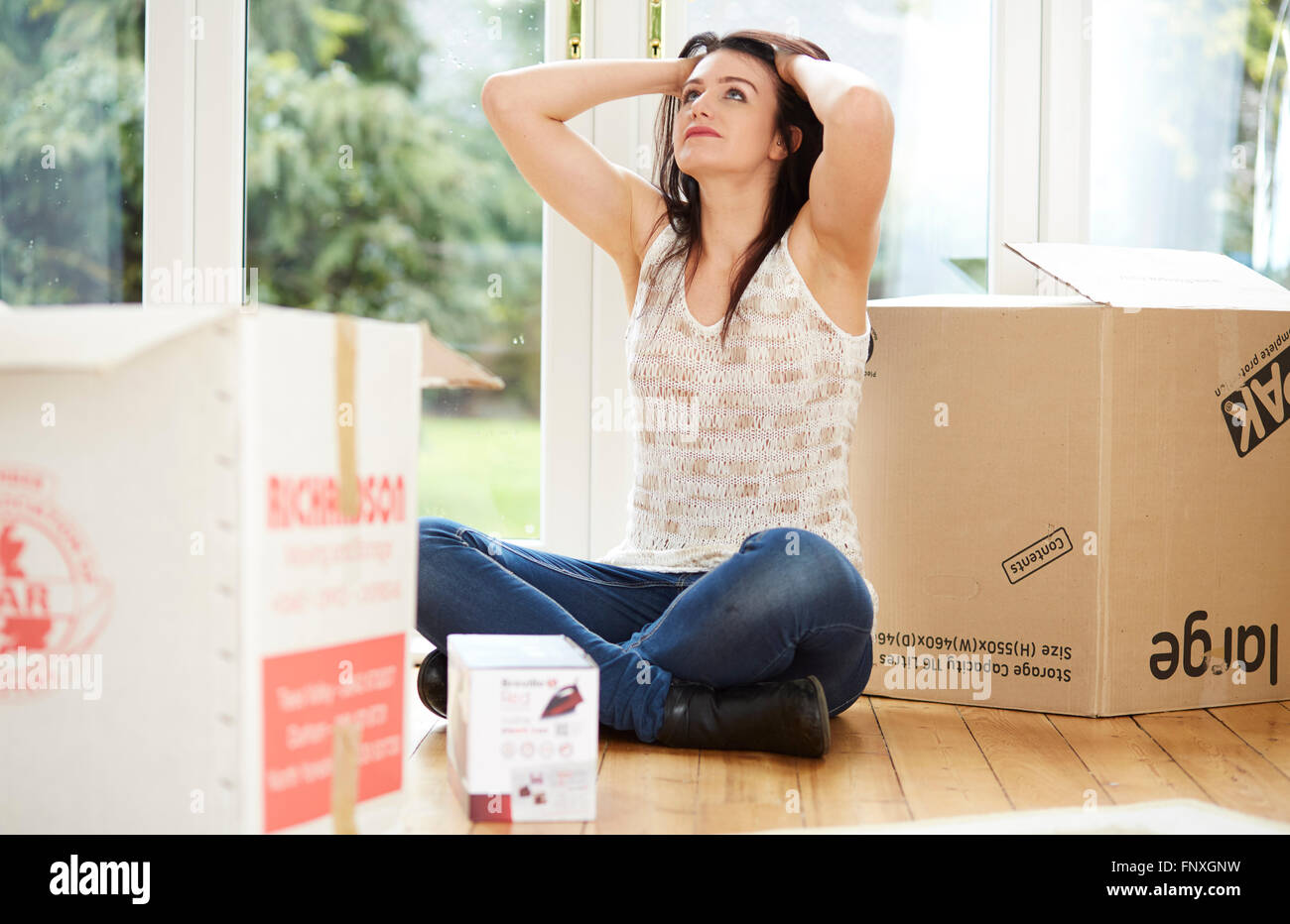 Woman moving house Stock Photo