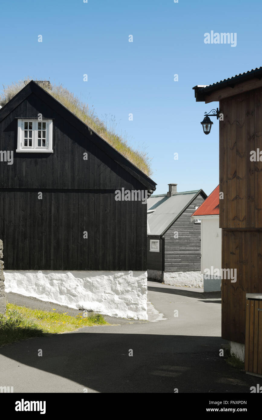 Traditional black wood and stone house with turf covered roof on the Faroe islands. Stock Photo
