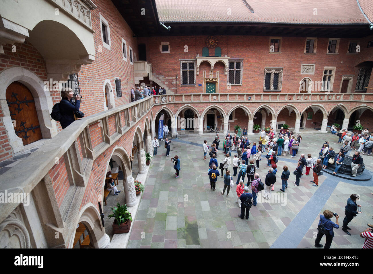 Poland, Krakow (Cracow), Collegium Maius (Great College) of Jagiellonian University, museum, group of tourists on sightseeing to Stock Photo