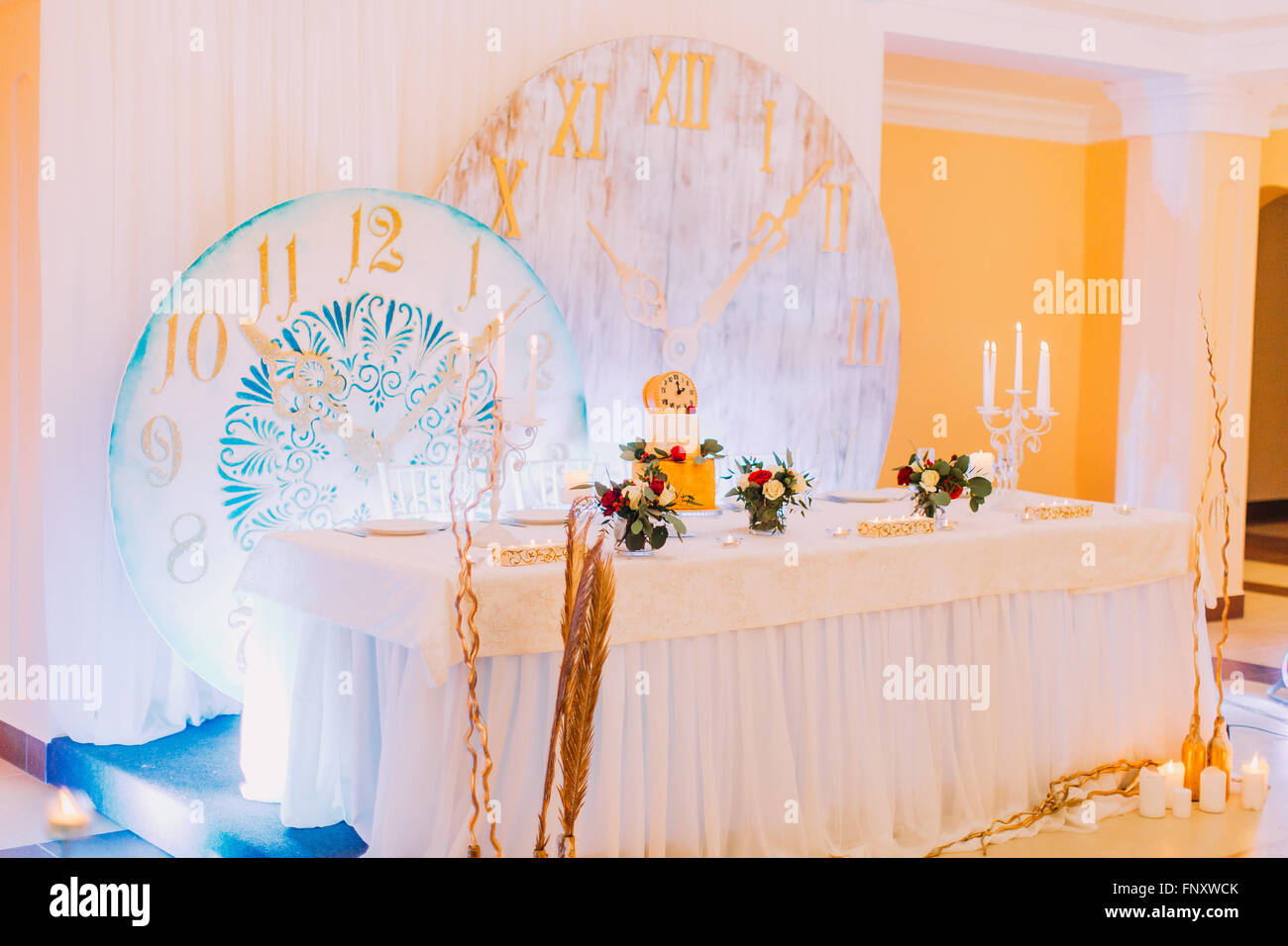 Beautiful wedding table decorated with flowers. Wedding cake. Sweets ...