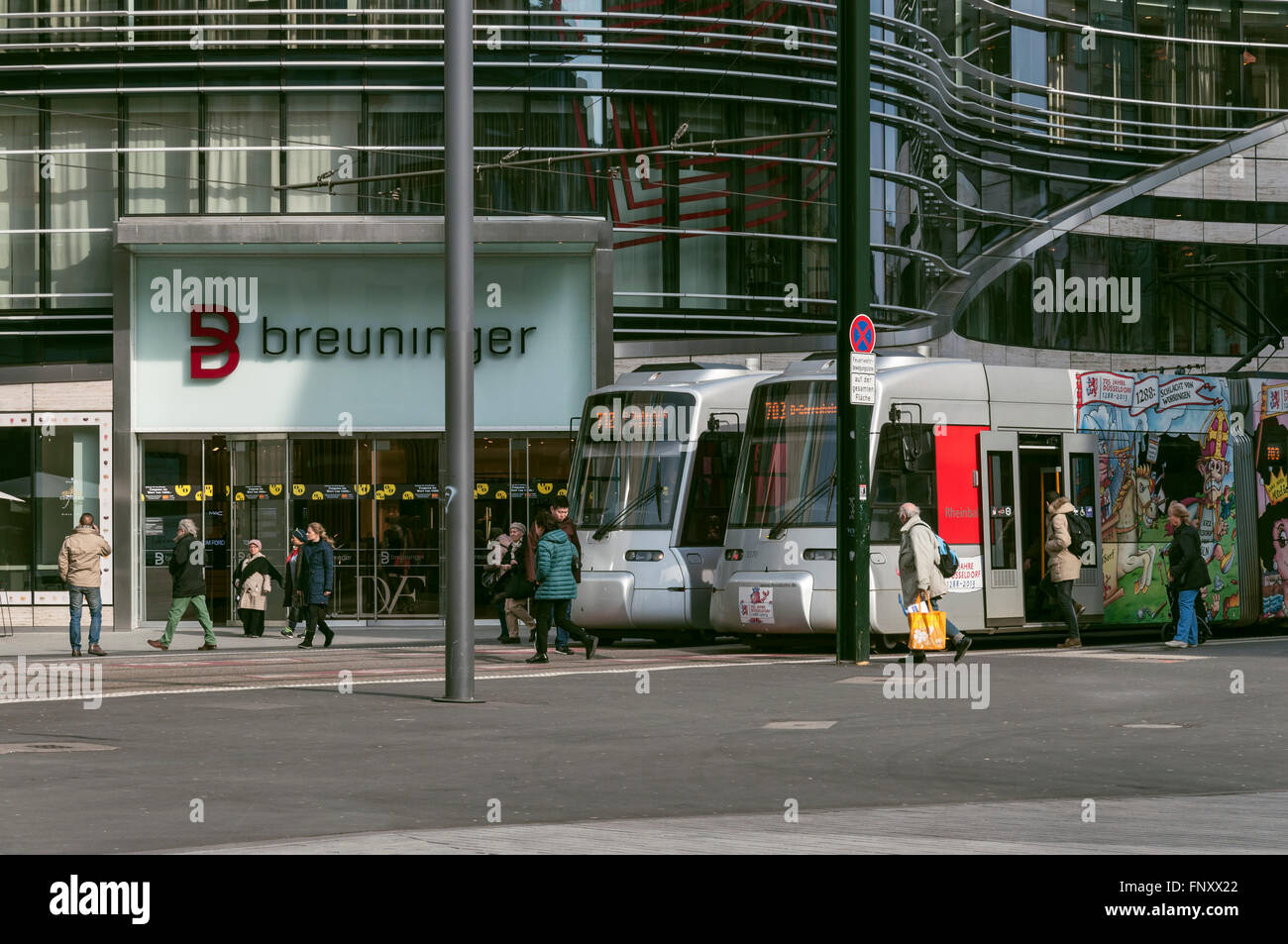 Trams passing the Kö Bogen in Düsseldorf, NRW Germany, historic view. Stock Photo