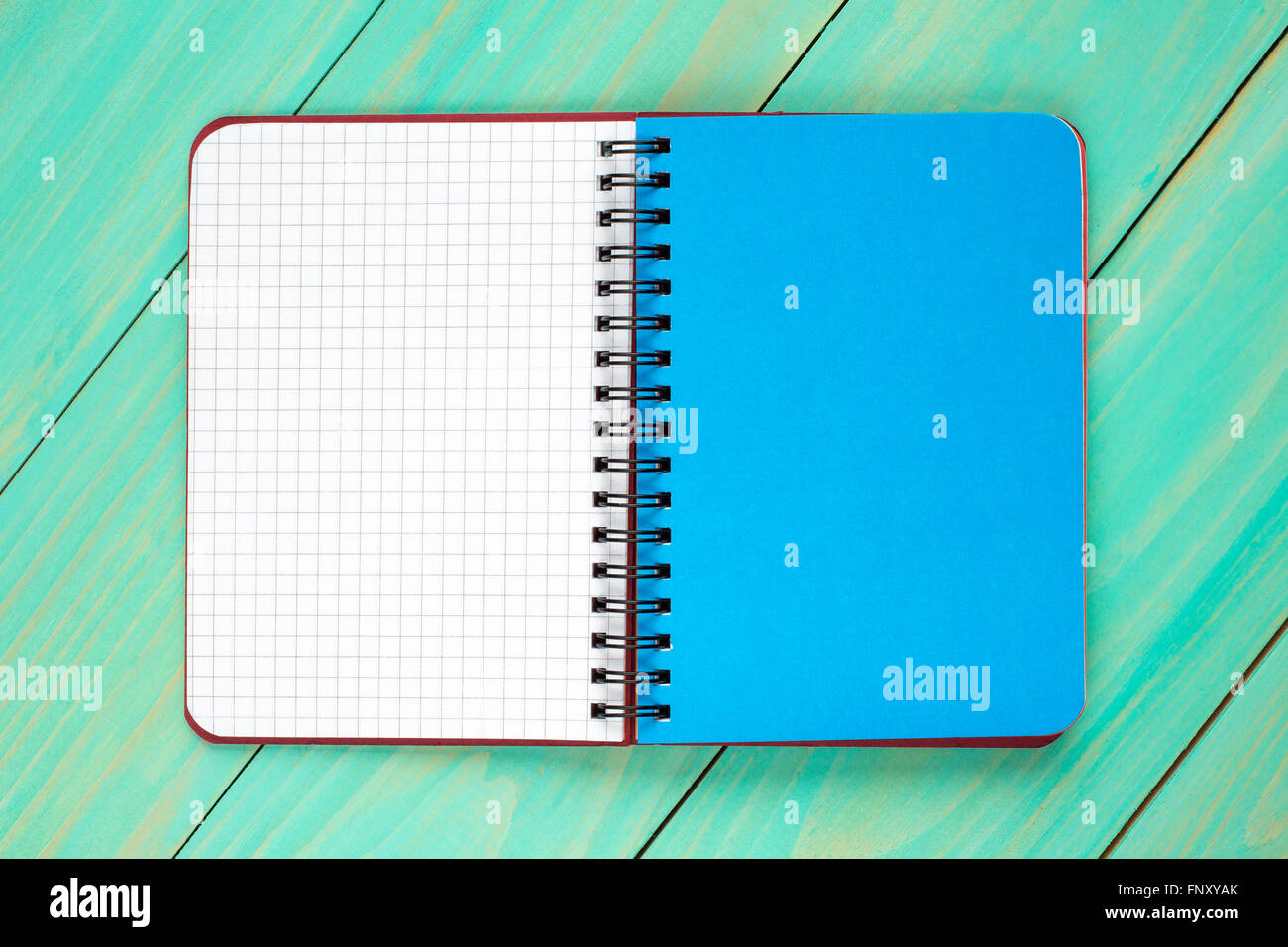 Open spiral notebook on the wooden background.Top view Stock Photo - Alamy