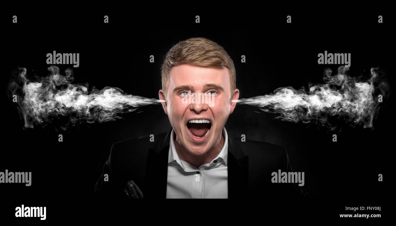Angry man with smoke coming out from his ears. Stock Photo