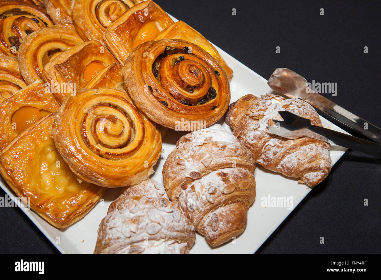 Croissant and pastries on plates at a breakfast meeting Stock Photo Alamy