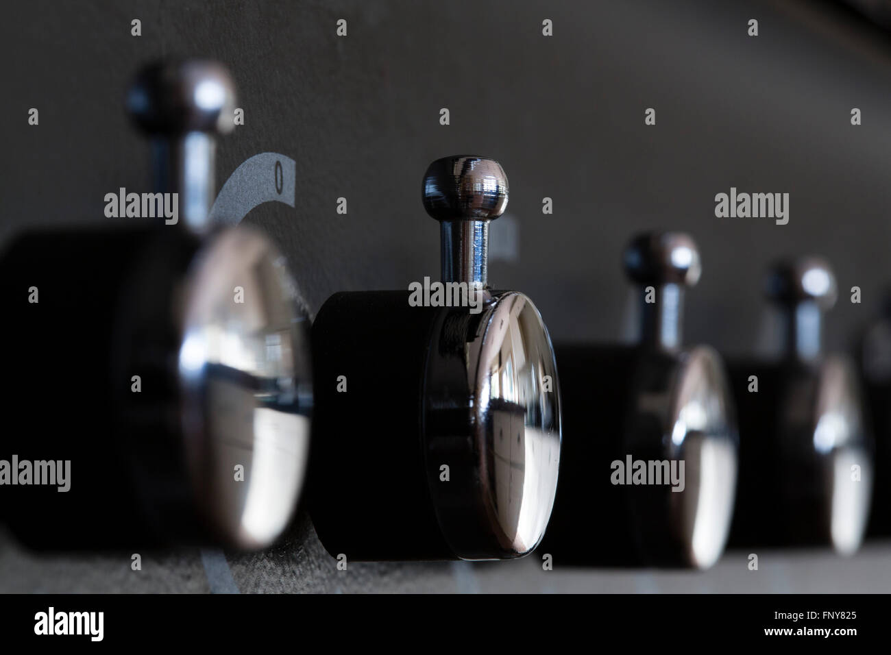 Close up of the control switches on a domestic cooker in a houce in the UK. Stock Photo