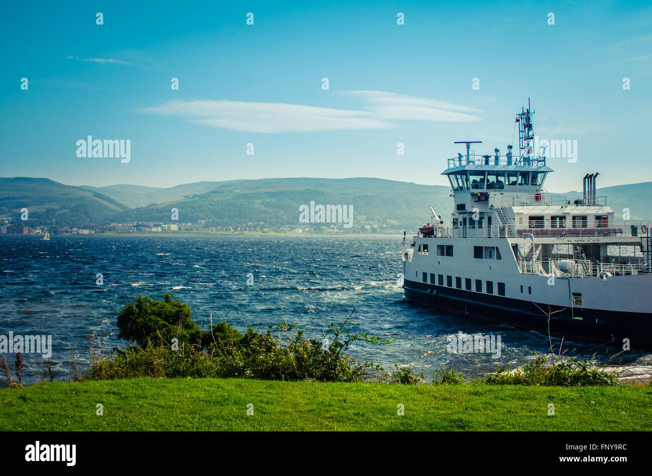 A Car Ferry Leaving Port  From A Scottish Island Stock Photo