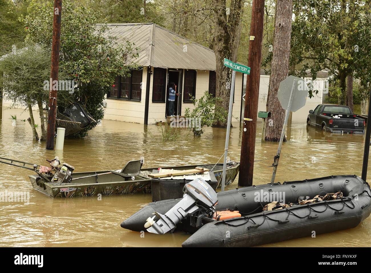 Residents look out from their homes submerged in floodwaters along the Pearl and Leaf Rivers after record breaking storms dumped rain across the deep south March 13, 2016 in Ponchatoula, Louisiana. Stock Photo