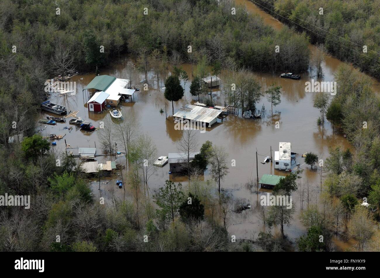 Aerial view of homes submerged in floodwaters along the Pearl and Leaf Rivers after record breaking storms dumped rain across the deep south March 13, 2016 in St. Tammany Parish, Louisiana. Stock Photo