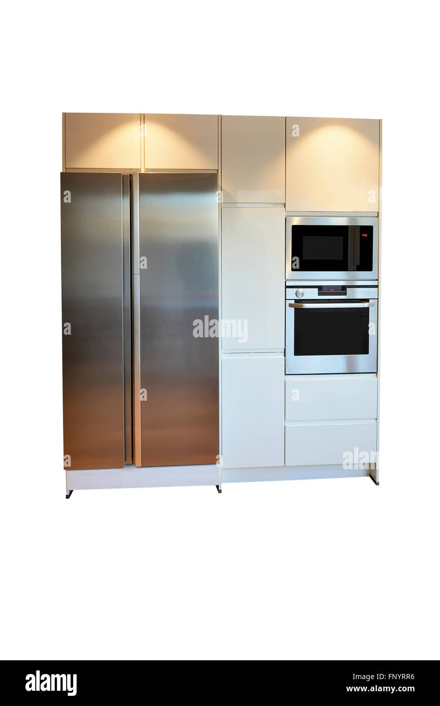 Stainless steel, side-by-side refrigerator and microwave isolated with clipping path Stock Photo