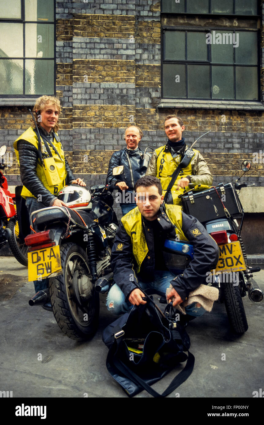 Motorcycle couriers in central London waiting on their next call in