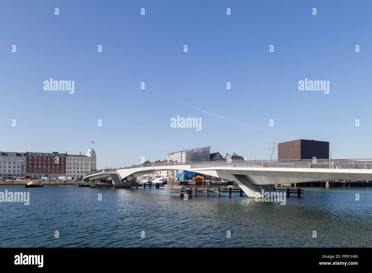 Copenhagen, Denmark - March 16, 2016: Inner Harbour pedestrian and cyclist bridge connecting Nyhavn and Christianshavn. Stock Photo