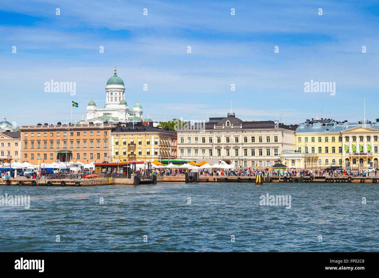 Helsinki cityscape. Central quay, building facades and dome of the main city cathedral on a background Stock Photo