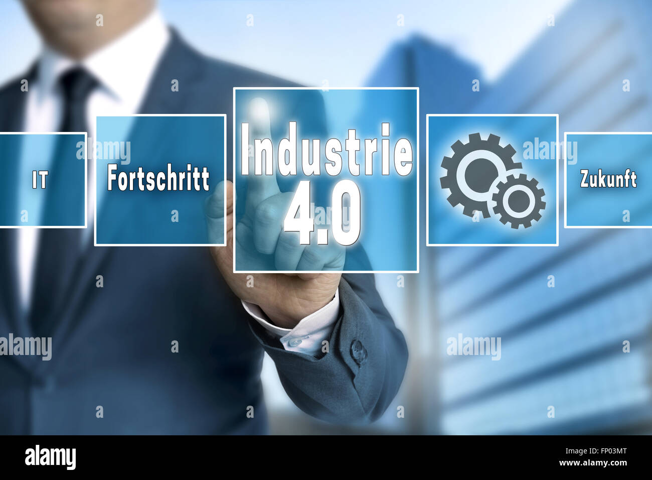 Industrie 4.0 in german industry touchscreen is operated by businessman background Stock Photo