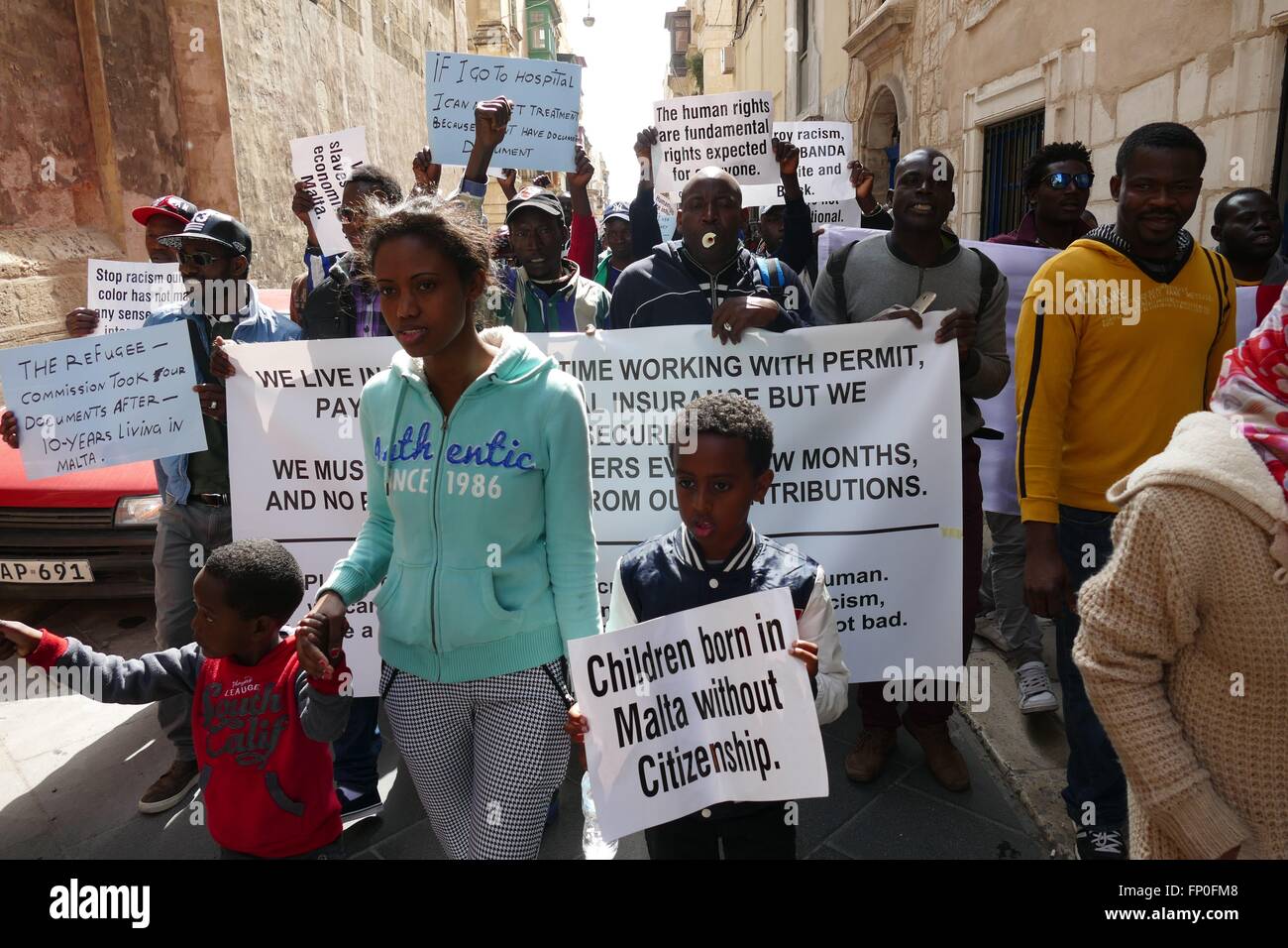 Valletta, Malta. 16 March, 2016. A woman originally from Ethiopia heads a peaceful protest through the streets of the Maltese capital today to protest over a lack of refugee status and rights. Credit:  Adam Alexander/Alamy Live News Stock Photo