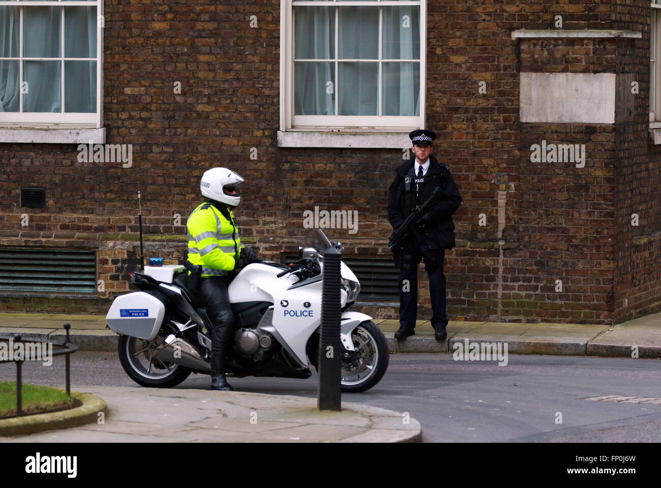 An armed police officer stands hi-res stock photography and images - Alamy