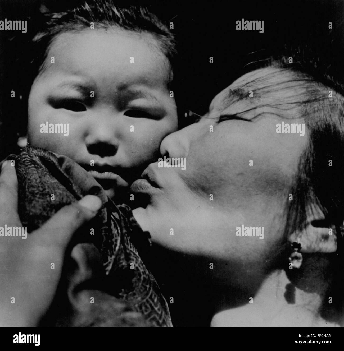 1962 - Photograph of mother and child in Mongolia, taken by Photographer Leos Nebor of Czechoslvakia. One of five hundred works in exhibition ''Woman'' to have its American premiere at the New York Cultural Center September 2 thru November 8. © Keystone Pictures USA/ZUMAPRESS.com/Alamy Live News Stock Photo