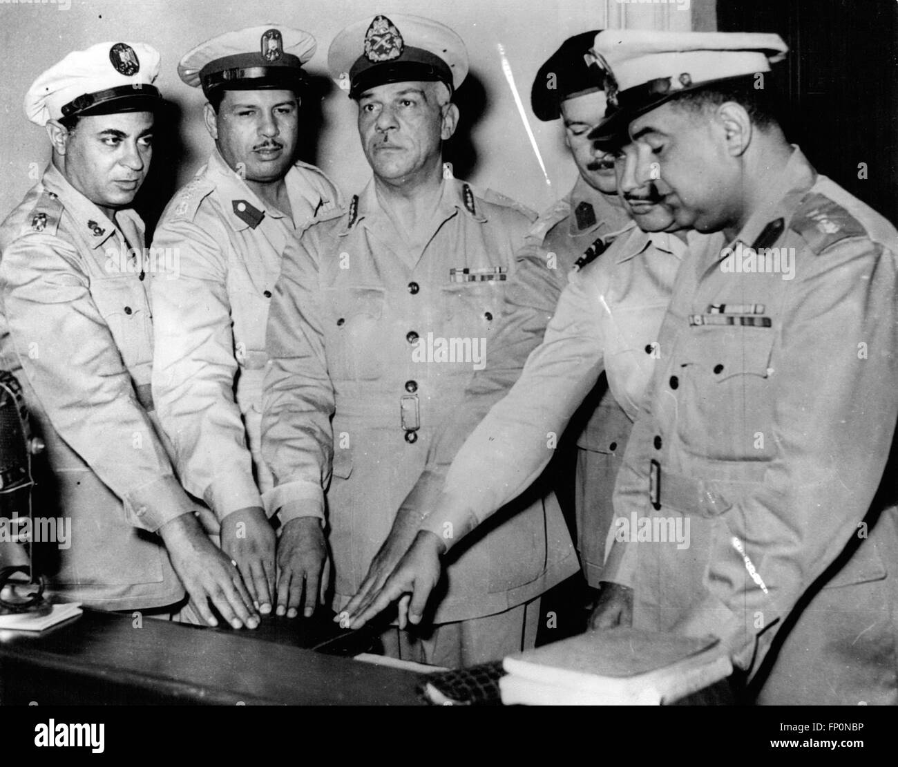 1952 - Twelve Accused In Cairo Conspiracy Case. Alleged Plot To Kill President Nasser. Twelve people are facing trial in Cairo - accused of attempting to overthrow the regime and to assassinate Colonel Nasser. They are also accused of planning to free former President General Neguib from house arrest and to appoint him President - and also of planning to de-nationalise the Suez Canal. Keystone Photo Shows:- Members of the Supreme Military Court - headed by General Mohamed Fuad El Digwy - take the oath - at opening of the trial in Cairo. © Keystone Pictures USA/ZUMAPRESS.com/Alamy Live News Stock Photo