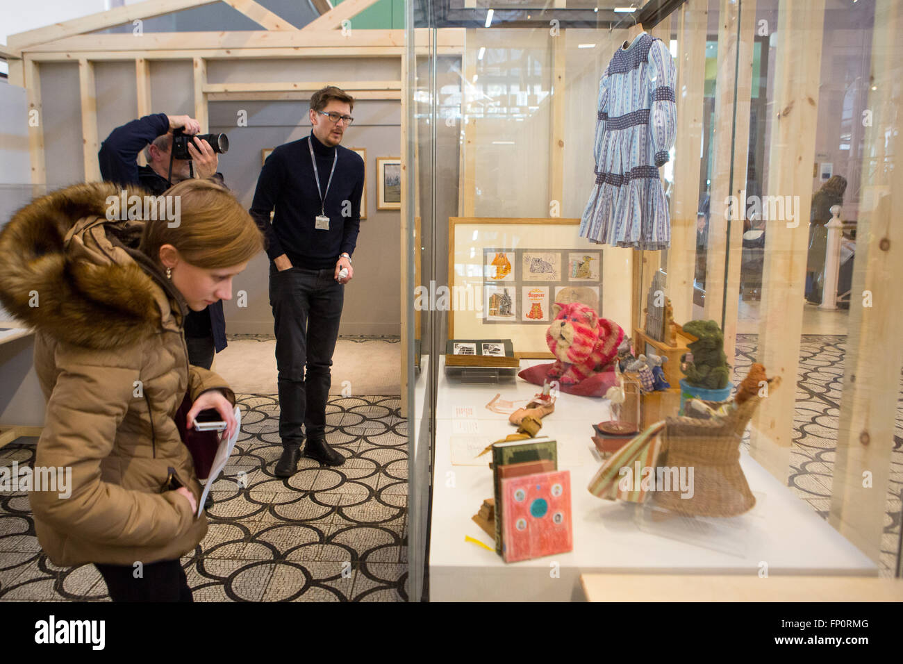 London, UK. 17th March 2016. People look at a cabinet containing Bagpuss memorabilia during a press view of 'The Clangers, Bagpuss & Co.' at the V&A Museum of Childhood in Bethnal Green, London.  The free exhibition runs from 19 March to 9 October 2016 Credit:  London pix/Alamy Live News Stock Photo