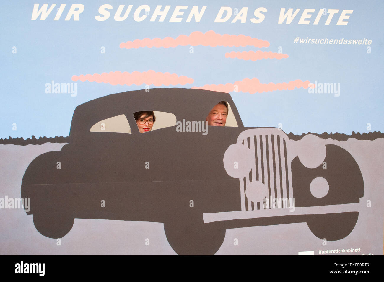 Berlin, Germany. 17th Mar, 2016. Co-curator Ina Dinter (l) and the Director of Kupferstichkabinett museum and curator of the exhibition 'Wir suchen das Weite' (lit. 'We're taking our heels'), Heinrich Schulze Altcappenberg looking through the painting 'Black Car' by artist John Wesley at the Kpuferstichkabinett in Berlin, Germany, 17 March 2016. The original painting by Gouache from 1989 is part of the exhibition that displays travel pictures from five centuries. The exhibition is open from 18 March 2016 to 25 September 2016. PHOTO: KLAUS-DIETMAR GABBERT/dpa/Alamy Live News Stock Photo
